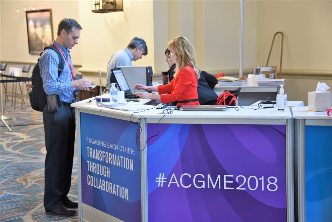 Andrea Rio hard at work at the Information Booth at this spring's Annual Educational Conference in Orlando, Florida